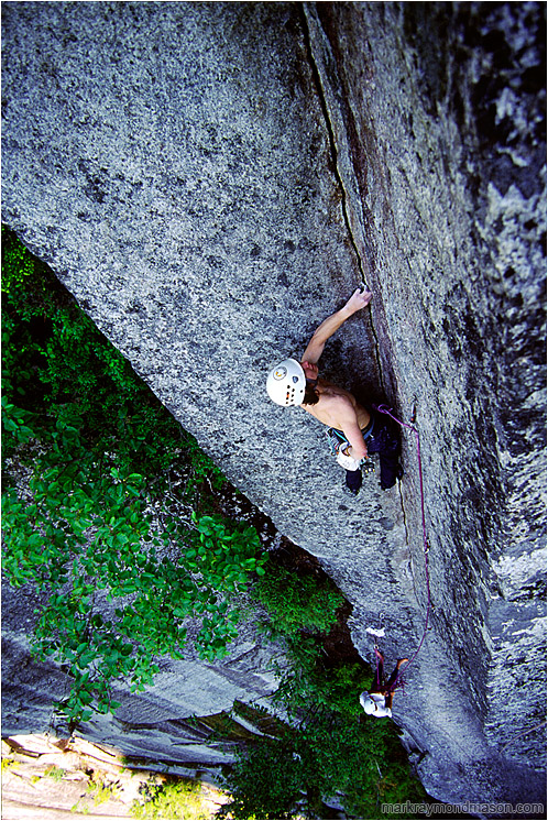 Chris on Planet Caravan: Squamish, BC, Canada (2002-00-00) - Climbing photo of a climber scaling a thin crack in a large, intimidating corner, high above the ground