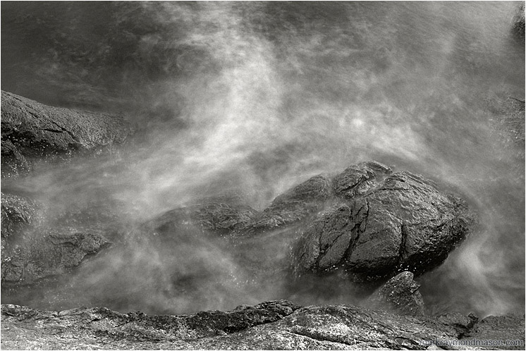 Rocky Shore, Surf (B&W): Near Vancouver, BC, Canada (2003-00-00) - Abstract black and white photograph of misty water crashing over rough, luminescent grey rocks