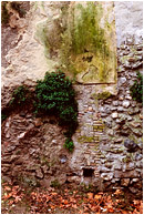 Patchwork Wall: Granada, Spain (2006) - Fine art photograph showing layers of ancient construction in an exposed concrete wall