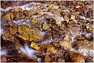 Broken Rocks, Stream: Limestone Lakes, BC, Canada (2007) - Fine art abstract photograph of an alpine stream flowing around broken yellowed limestone blocks