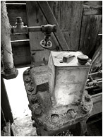 Valves, Metal Can, Daylight (B&W): Near Dawson, YT, Canada (2010) - Fine art black and white photograph showing a petrol can inside the remains of an ancient excavator