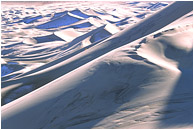 Big Dunes, Snow: Death Valley, CA, USA (2003) - Abstract photograph of huge sand dunes, snow, and shadows deep in the desert