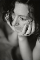 Terri, Daydreaming (B&W): Calgary, AB, Canada (2008) - Fine art black and white photograph of a beautiful woman with her head in her hands and curled hair on her face