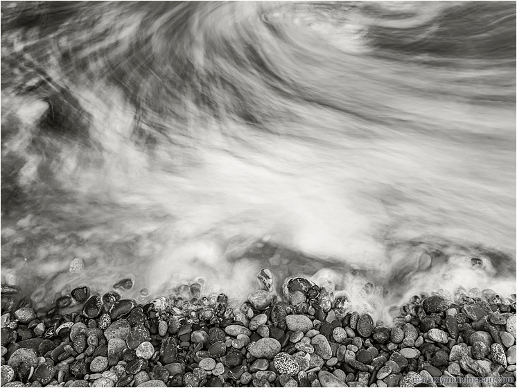 Rocks, Clouded Sea: Olympic National Park, WA, USA (2017-08-16) - Fine art black and white long-exposure photograph showing moving water swirling like fog around seaside stones