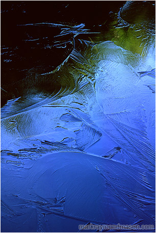 Fine art abstract photograph of colors, shapes and reflections in a frozen lake