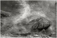 Rocky Shore, Surf (B&W): Near Vancouver, BC, Canada (2003) - Abstract black and white photograph of misty water crashing over rough, luminescent grey rocks