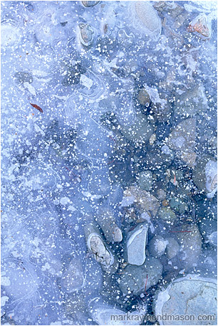 Abstract photo showing rocks and ice, dusted with snow crystals