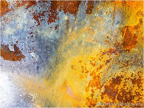 Fine art abstract photograph of a yellow fog and abstract storm forming on rusting sheet metal