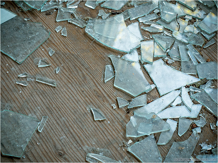 Plywood Floor, Shattered Glass, Highlights: Near Chase, BC, Canada (2017-05-20) - Fine art abstract photo showing shattered window glass and blurry reflections of fall colours on a bare, grainy plywood floor